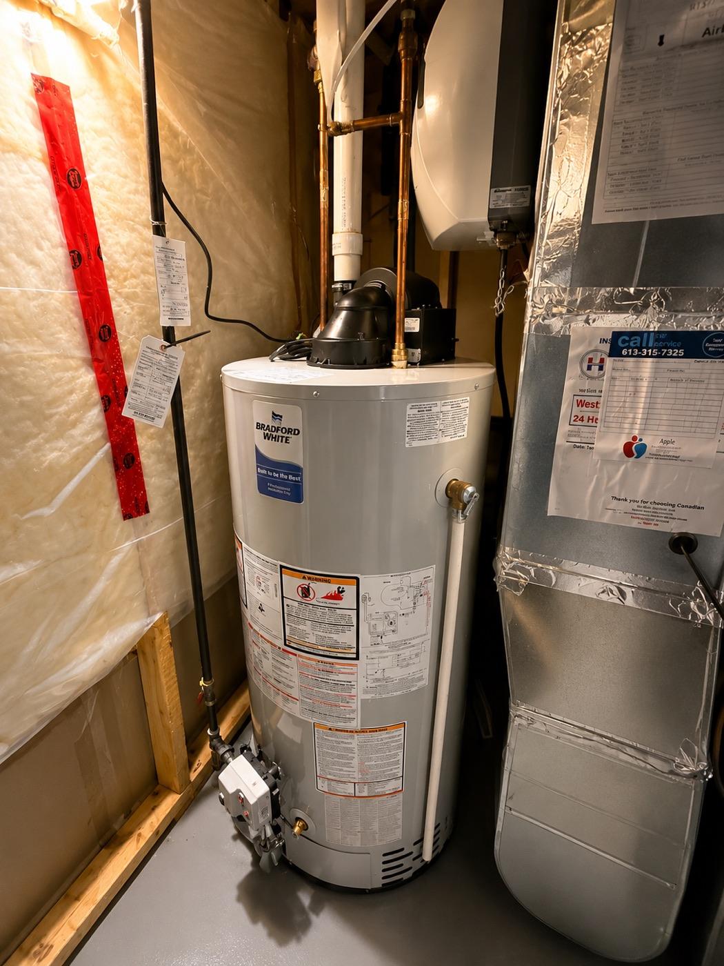 Lennox high-efficiency furnace installed beside a water heater in an Ottawa home basement